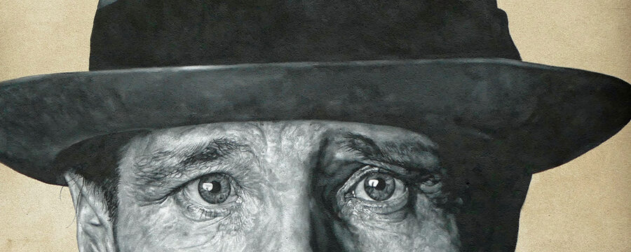 Das Wandgemälde zeigt das Gesicht von Joseph Beuys oberhalb des Mundes. Wie immer: mit Hut