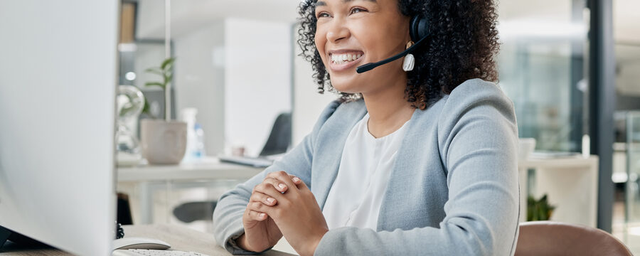 Black woman, call center and computer with CRM and contact us, phone call with customer service or telemarketing. Tech support, tech and office with communication and contact center female employee.